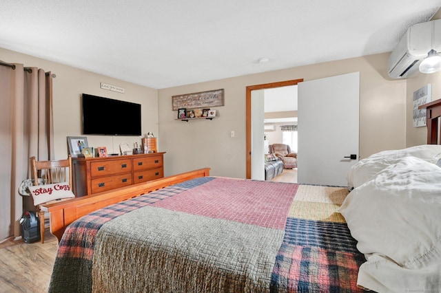 18 Nye St, Vernon, CT 06066 - bedroom featuring an AC wall unit and wood finished floors