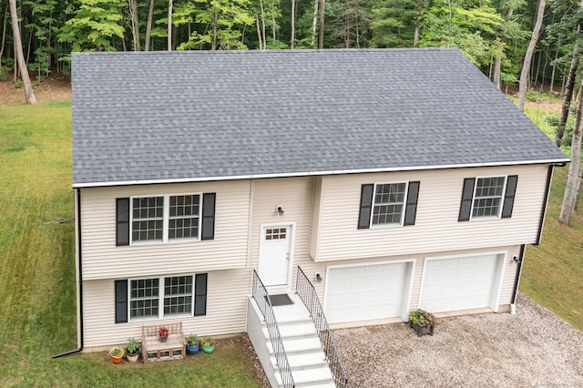 233 W Rd, East Haddam, CT 06420 - split foyer home with driveway, a garage, a front lawn, and roof with shingles