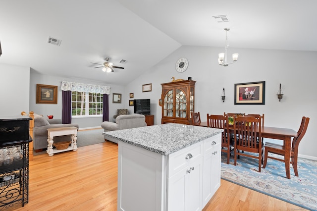 233 W Rd, East Haddam, CT 06420 - kitchen featuring light wood-type flooring, white cabinetry, vaulted ceiling, pendant lighting, and a ceiling fan