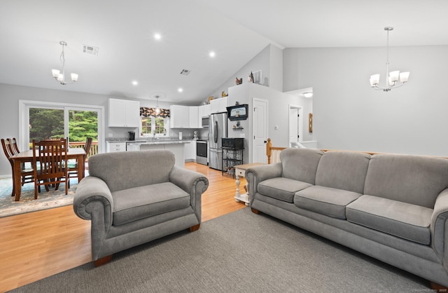 233 W Rd, East Haddam, CT 06420 - living room with a chandelier, light wood-type flooring, high vaulted ceiling, and recessed lighting