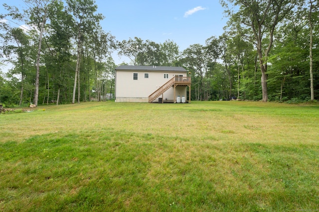 233 W Rd, East Haddam, CT 06420 - view of grassy yard with stairs and a wooden deck