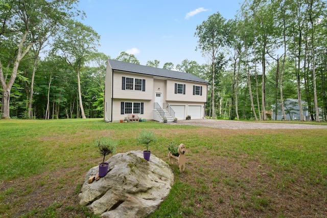 233 W Rd, East Haddam, CT 06420 - bi-level home featuring a garage, a front yard, and driveway