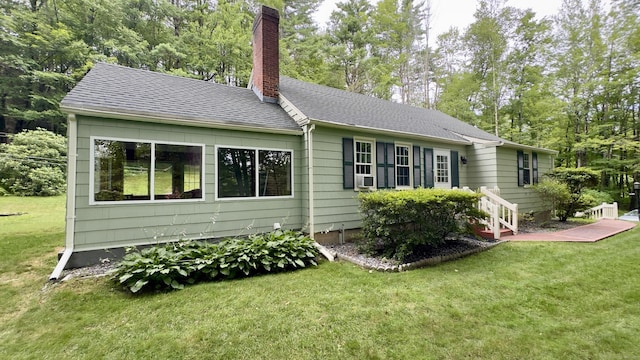 147 Smith Hill Rd, Winchester, CT 06098 - view of side of property featuring a chimney, a yard, roof with shingles, and view of scattered trees