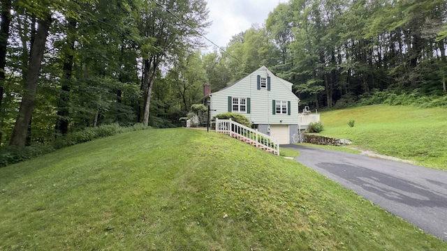 147 Smith Hill Rd, Winchester, CT 06098 - view of front of house with a chimney, asphalt driveway, an attached garage, and a front yard