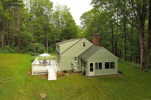 147 Smith Hill Rd, Winchester, CT 06098 - back of house with a chimney, a deck, a yard, and a wooded view