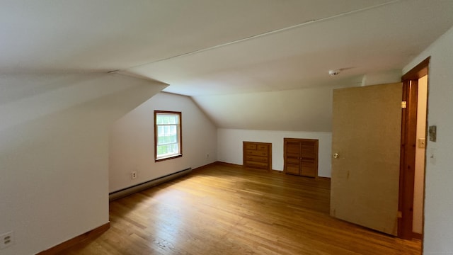 147 Smith Hill Rd, Winchester, CT 06098 - additional living space with a baseboard radiator, wood finished floors, and vaulted ceiling