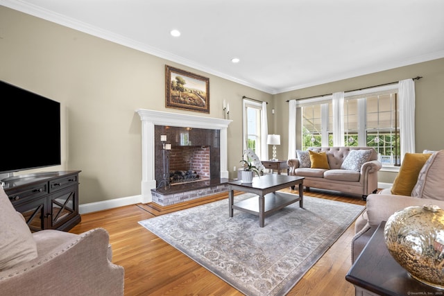 31 Crimson Hts, Portland, CT 06480 - living area featuring plenty of natural light, crown molding, wood finished floors, a fireplace with raised hearth, and recessed lighting