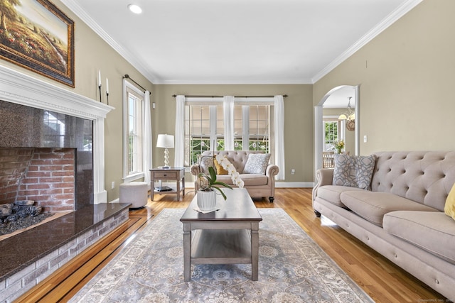31 Crimson Hts, Portland, CT 06480 - living area featuring crown molding, wood finished floors, and arched walkways