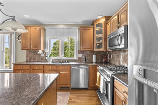 31 Crimson Hts, Portland, CT 06480 - kitchen featuring stainless steel appliances, light wood finished floors, glass insert cabinets, dark stone countertops, and recessed lighting