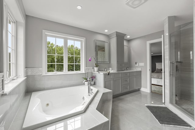 31 Crimson Hts, Portland, CT 06480 - full bathroom with double vanity, a whirlpool tub, recessed lighting, and tile patterned floors