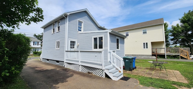 108 School St, Hamden, CT 06518 - back of house featuring a wooden deck, crawl space, a yard, and a patio area
