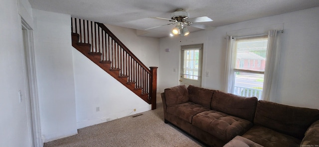 108 School St, Hamden, CT 06518 - carpeted living room featuring stairs and ceiling fan