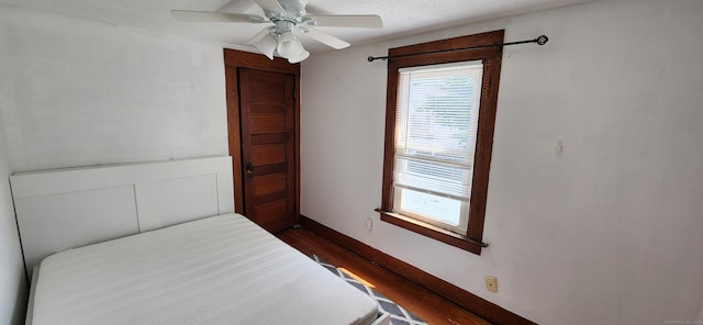 108 School St, Hamden, CT 06518 - unfurnished bedroom with dark wood-style flooring and a ceiling fan