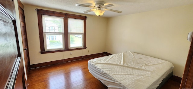 108 School St, Hamden, CT 06518 - bedroom featuring wood finished floors, ceiling fan, and a textured ceiling