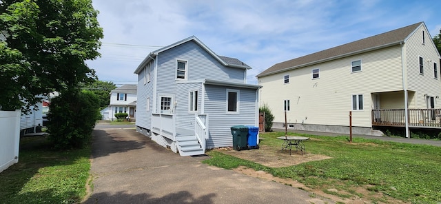 108 School St, Hamden, CT 06518 - back of house featuring a lawn