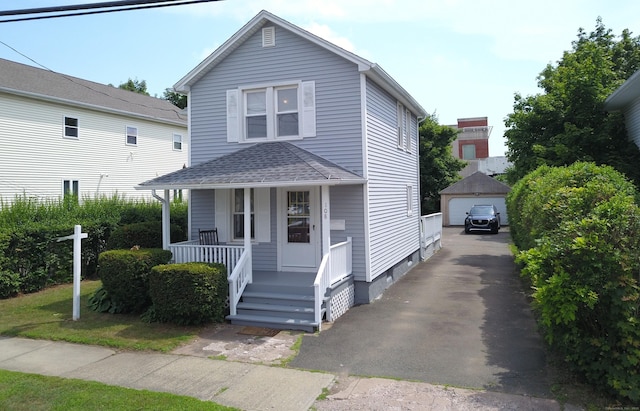 108 School St, Hamden, CT 06518 - view of front of property featuring an outdoor structure, covered porch, a shingled roof, a garage, and driveway