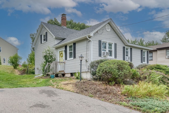 6 Rau Street Ext, Vernon, CT 06066 - view of front facade with a chimney, roof with shingles, a front yard, and cooling unit