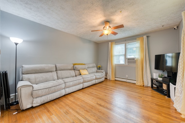 6 Rau Street Ext, Vernon, CT 06066 - living room with baseboard heating, a textured ceiling, light wood-type flooring, ceiling fan, and a baseboard radiator