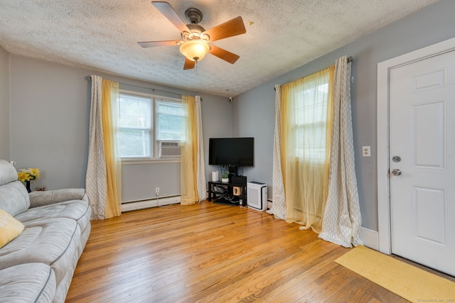 6 Rau Street Ext, Vernon, CT 06066 - living area with a baseboard heating unit, a textured ceiling, ceiling fan, and light wood-style flooring