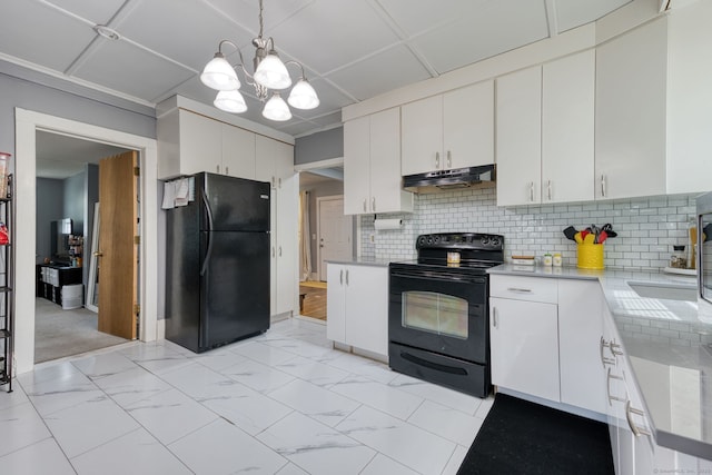 6 Rau Street Ext, Vernon, CT 06066 - kitchen featuring black appliances, under cabinet range hood, light countertops, a chandelier, and tasteful backsplash
