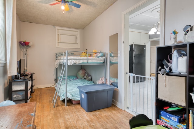 6 Rau Street Ext, Vernon, CT 06066 - bedroom featuring freestanding refrigerator, wood finished floors, and a ceiling fan