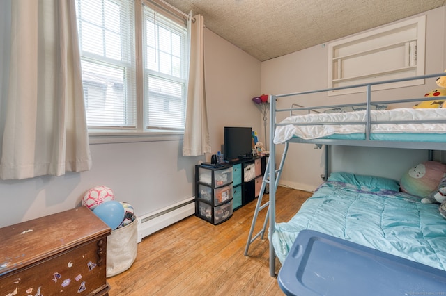 6 Rau Street Ext, Vernon, CT 06066 - bedroom featuring a baseboard radiator, wood finished floors, and multiple windows