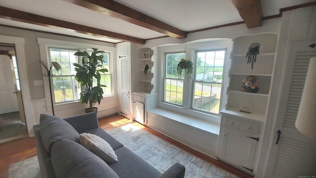62 Park St, Stafford, CT 06076 - living area featuring light wood-style flooring, beam ceiling, and arched walkways