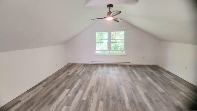 62 Park St, Stafford, CT 06076 - bonus room with a baseboard radiator, ceiling fan, wood finished floors, and vaulted ceiling