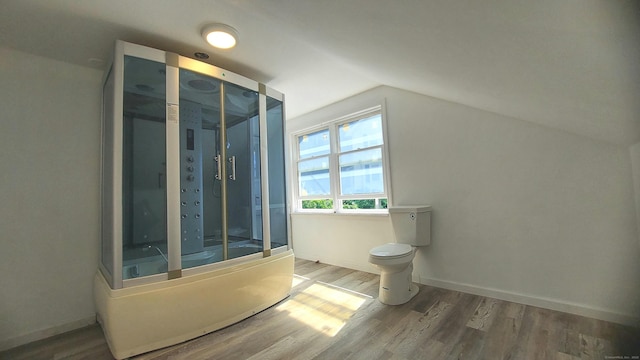 62 Park St, Stafford, CT 06076 - full bathroom with wood finished floors, vaulted ceiling, a shower with door, and a bath