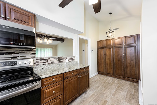 17 Pilgrim Hbr Unit A, Wallingford, CT 06492 - kitchen with appliances with stainless steel finishes, ceiling fan, tasteful backsplash, light wood finished floors, and decorative light fixtures