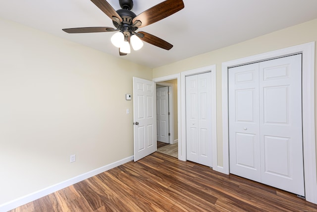 17 Pilgrim Hbr Unit A, Wallingford, CT 06492 - unfurnished bedroom featuring two closets, dark wood-style flooring, and ceiling fan