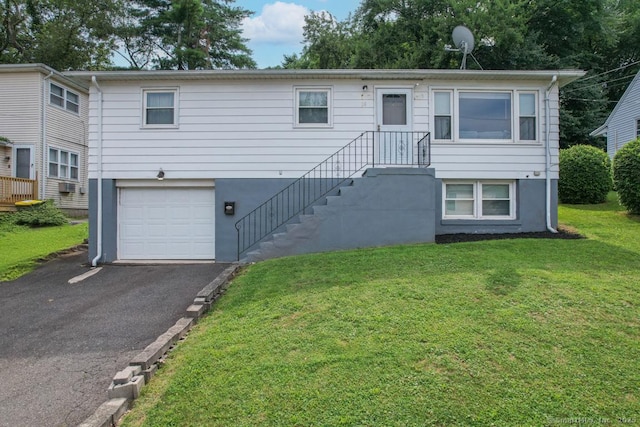 116 Esther Ave, Waterbury, CT 06708 - view of front of home featuring a garage, driveway, and a front yard