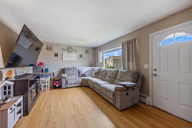 116 Esther Ave, Waterbury, CT 06708 - living area with a baseboard radiator and light wood-style floors