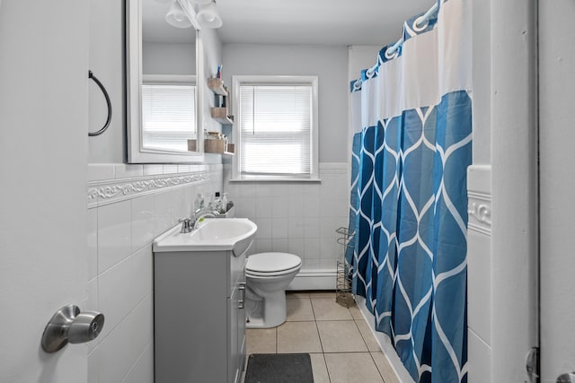 116 Esther Ave, Waterbury, CT 06708 - bathroom with vanity, tile patterned floors, tile walls, wainscoting, and curtained shower