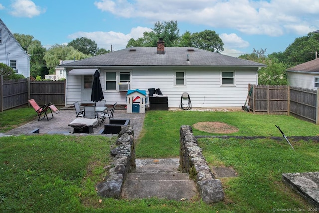 116 Esther Ave, Waterbury, CT 06708 - back of house featuring a patio, a fenced backyard, and a chimney
