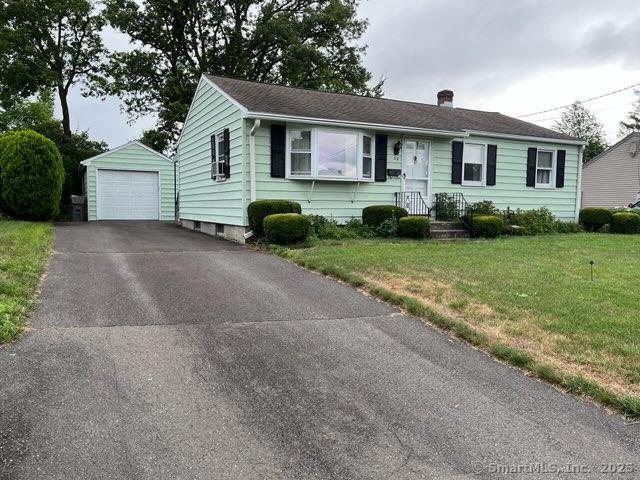117 Lyons Rd, Bristol, CT 06010 - ranch-style home with driveway, an outbuilding, a garage, a front lawn, and a chimney