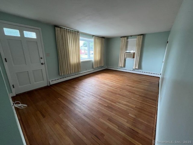 117 Lyons Rd, Bristol, CT 06010 - entryway with wood finished floors and a baseboard radiator