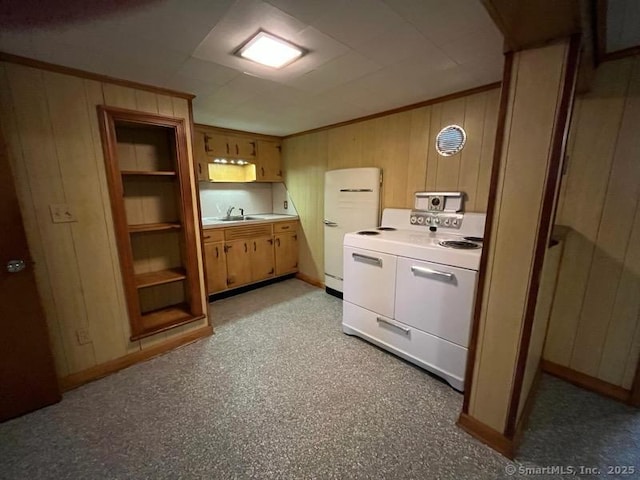 117 Lyons Rd, Bristol, CT 06010 - kitchen with white appliances, wooden walls, light countertops, and crown molding