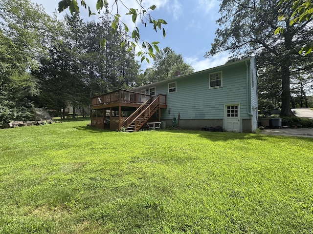 105 Chesterfield Rd, East Lyme, CT 06333 - rear view of property with stairway, a deck, and a lawn