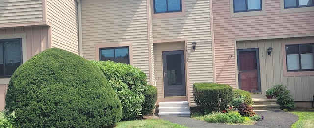 108 Greenwoods Ln Unit 108, East Windsor, CT 06088 - view of exterior entry featuring board and batten siding