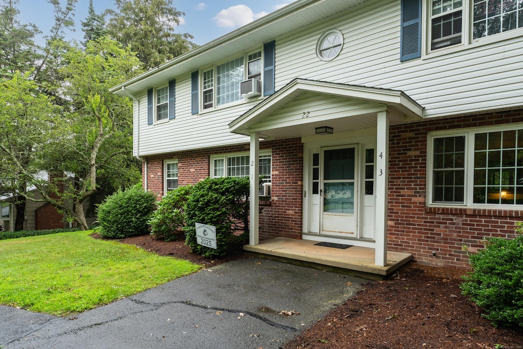 22 College St Apt 3, Clinton, CT 06413 - view of front of home featuring brick siding and cooling unit
