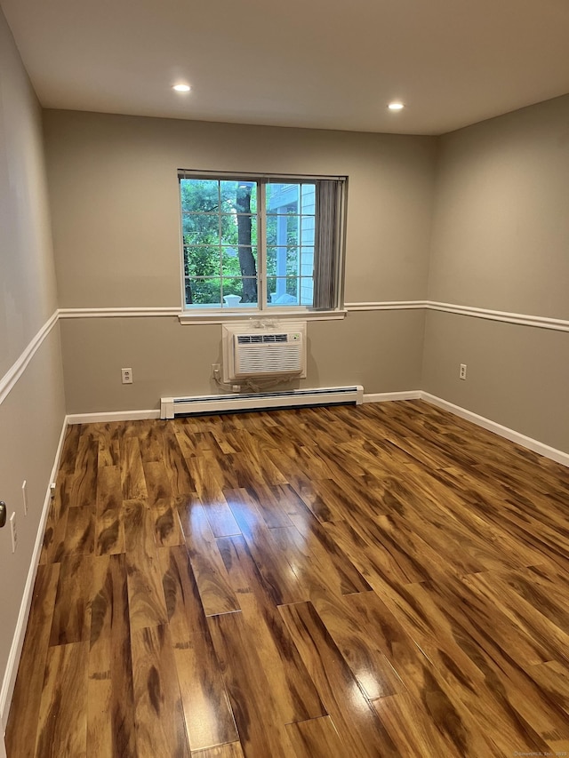 2955 Madison Ave Apt 40, Bridgeport, CT 06606 - empty room with an AC wall unit, a baseboard heating unit, wood finished floors, and recessed lighting