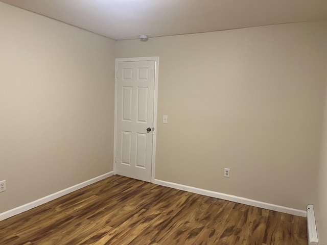2955 Madison Ave Apt 40, Bridgeport, CT 06606 - unfurnished room featuring a baseboard radiator and dark wood-style flooring