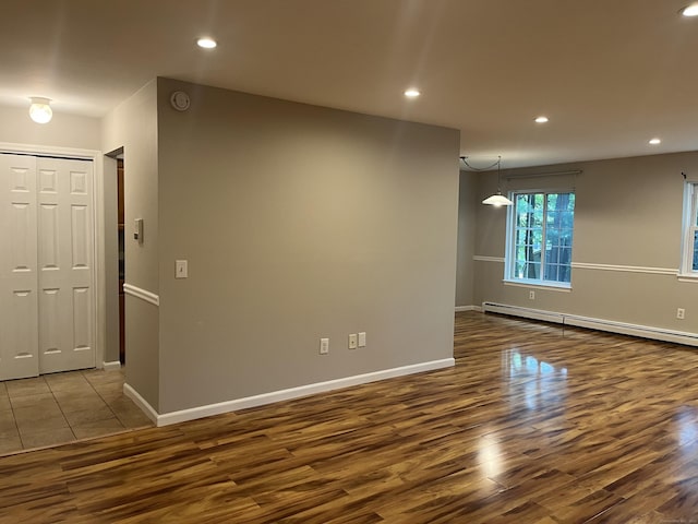 2955 Madison Ave Apt 40, Bridgeport, CT 06606 - unfurnished room with wood finished floors, recessed lighting, a smoke detector, and a baseboard heating unit