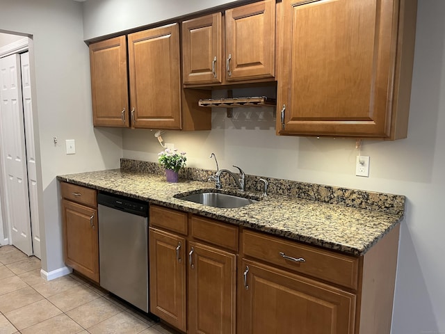 2955 Madison Ave Apt 40, Bridgeport, CT 06606 - kitchen featuring dishwasher, light tile patterned flooring, dark stone countertops, and brown cabinets