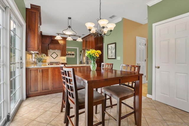 2 Kimberly Way, Marlborough, CT 06447 - dining room with light tile patterned floors, crown molding, and a chandelier