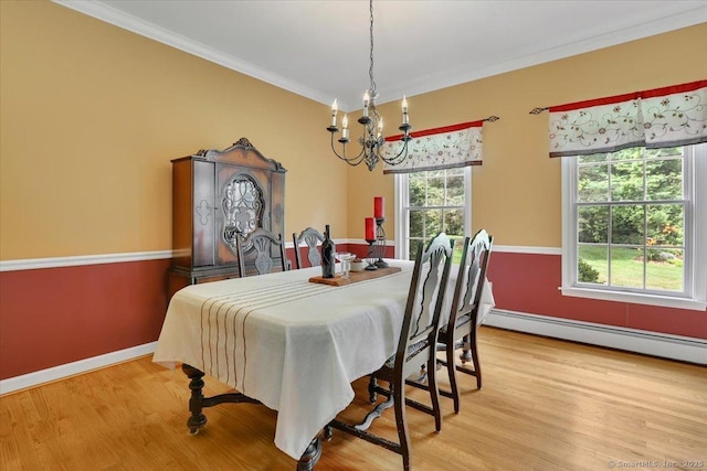 2 Kimberly Way, Marlborough, CT 06447 - dining space featuring a chandelier, crown molding, wood finished floors, and baseboard heating