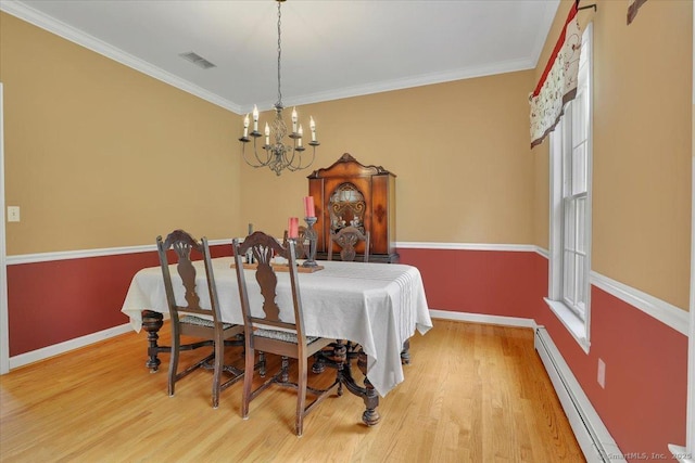 2 Kimberly Way, Marlborough, CT 06447 - dining area with a chandelier, crown molding, wood finished floors, and baseboard heating