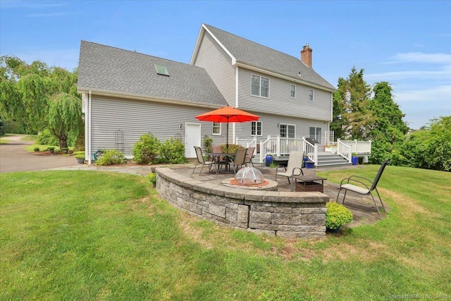 2 Kimberly Way, Marlborough, CT 06447 - rear view of property featuring a lawn, a patio, a deck, a chimney, and an outdoor fire pit