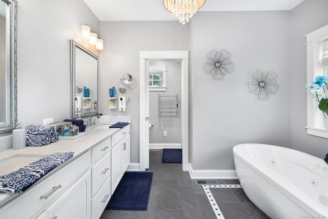 14 Finn Ln, Plainfield, CT 06374 - full bathroom with a soaking tub, double vanity, tile patterned floors, and a chandelier